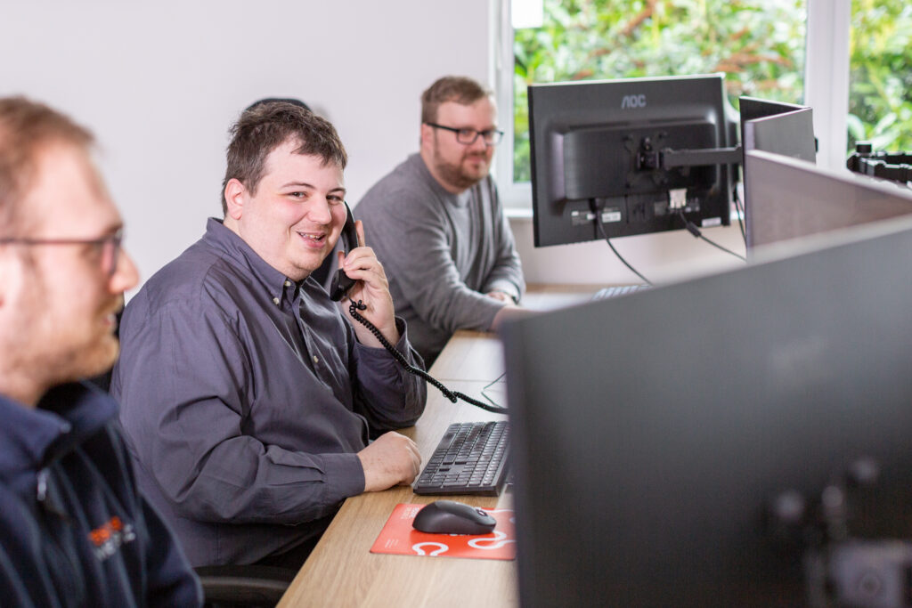 man holding phone smiling