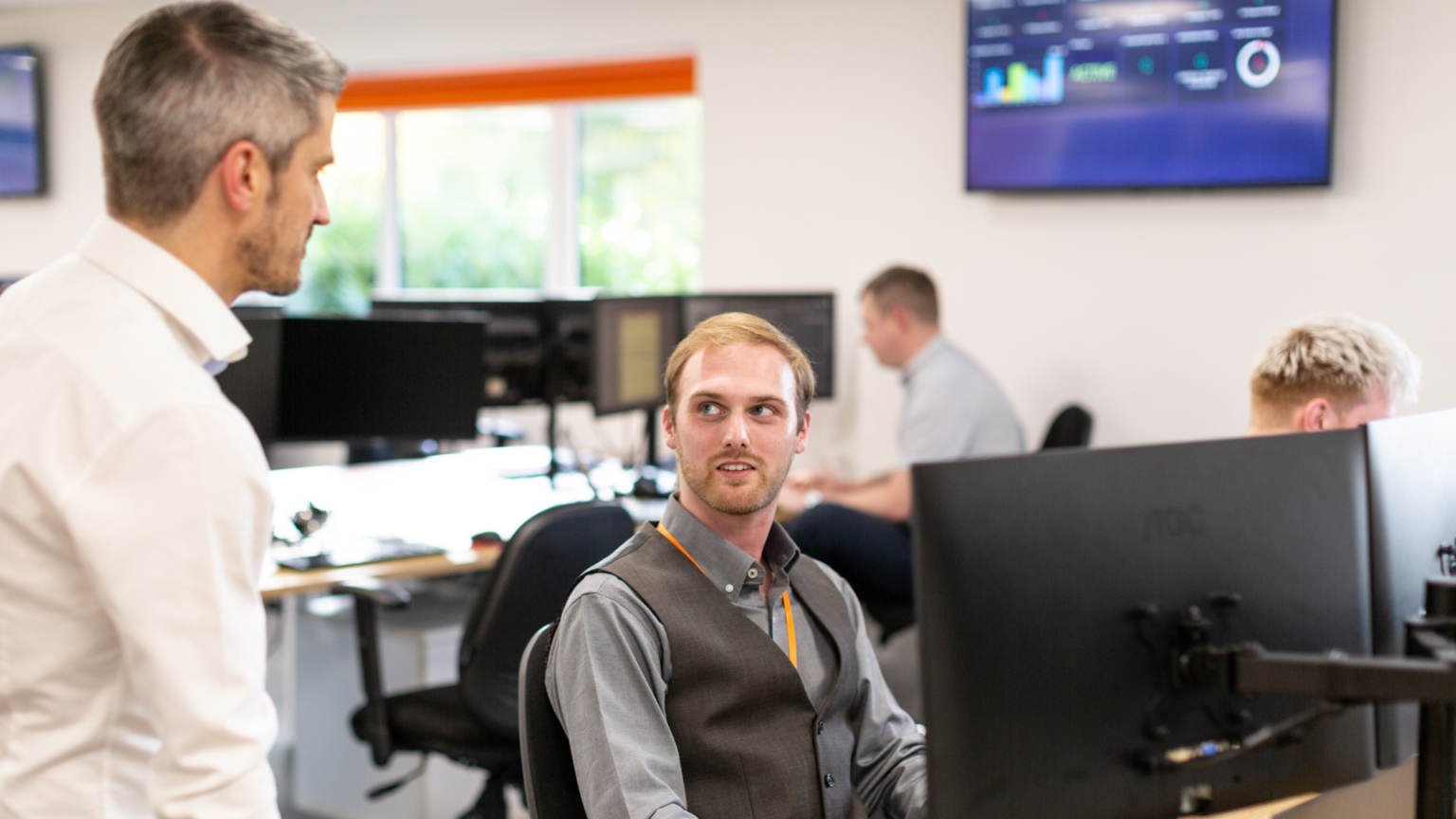 Two people talking in an office
