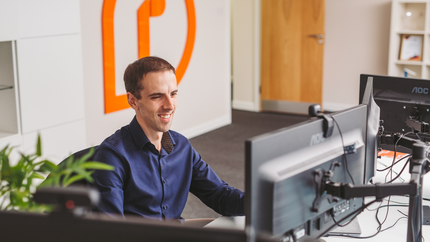 Jude sitting at a computer