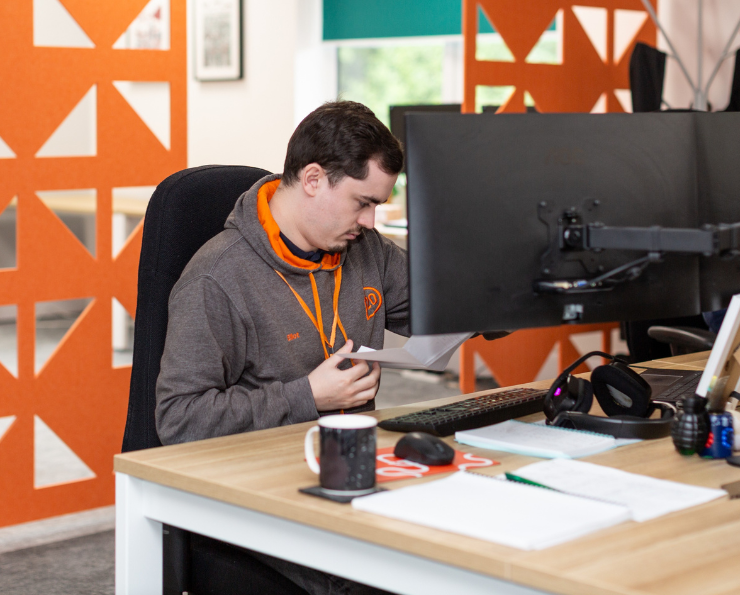 Staff member sat at his computer