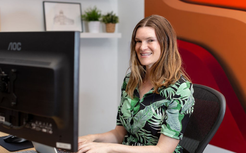 Team member sat at her computer