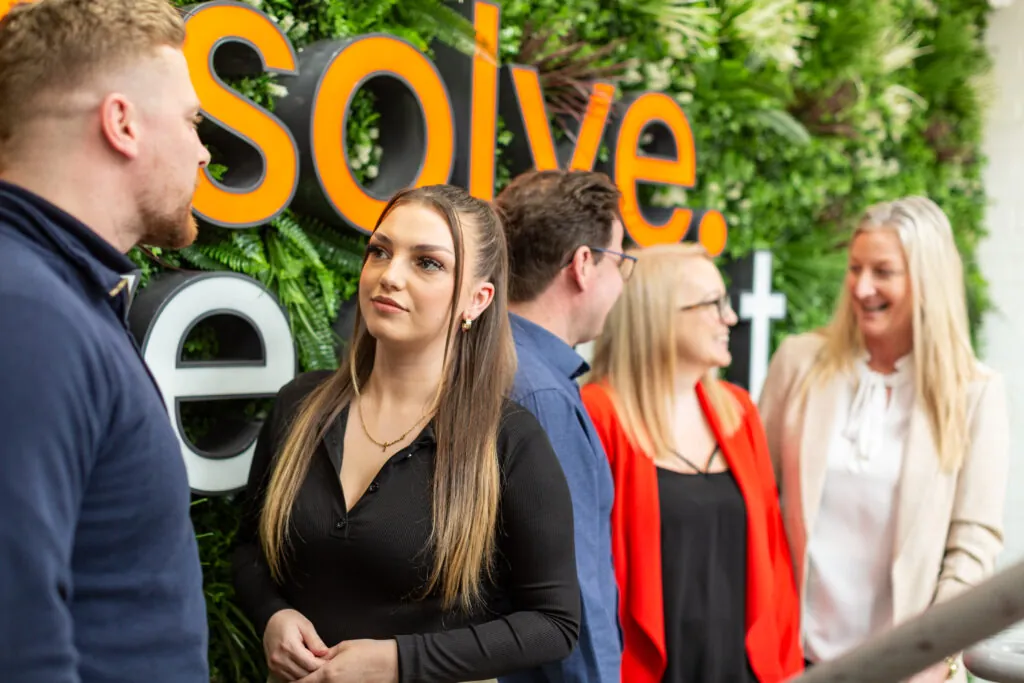 people in front of living wall